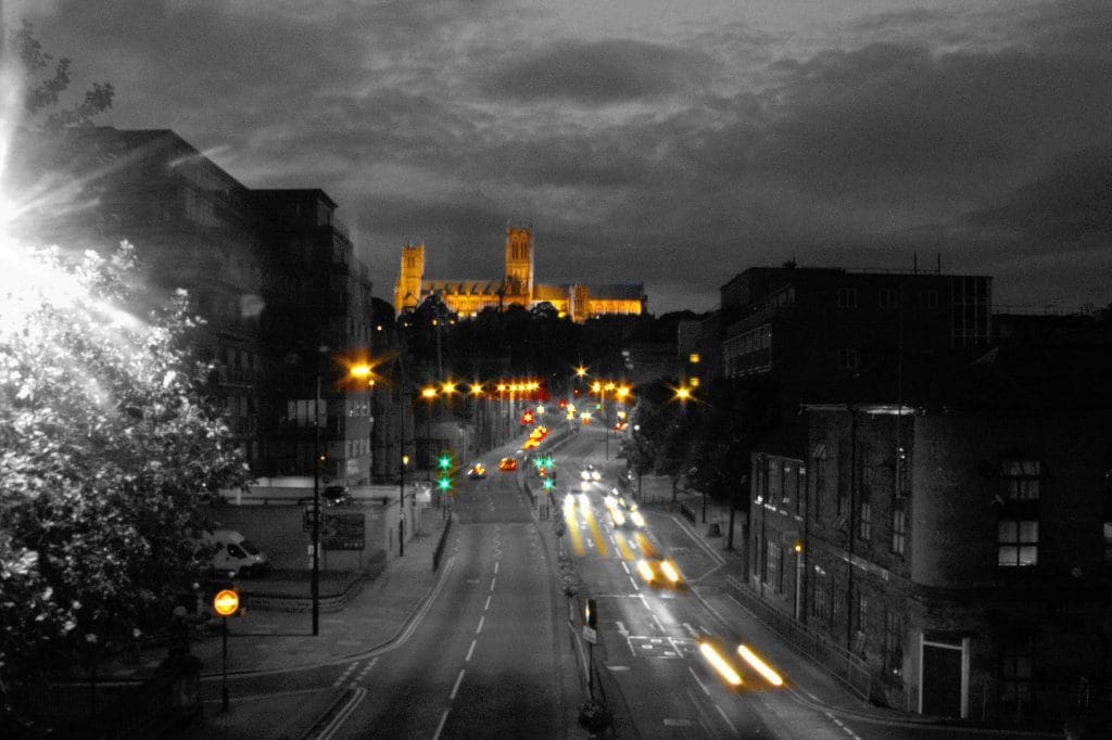 lincoln cathedral + lights from cars at night
