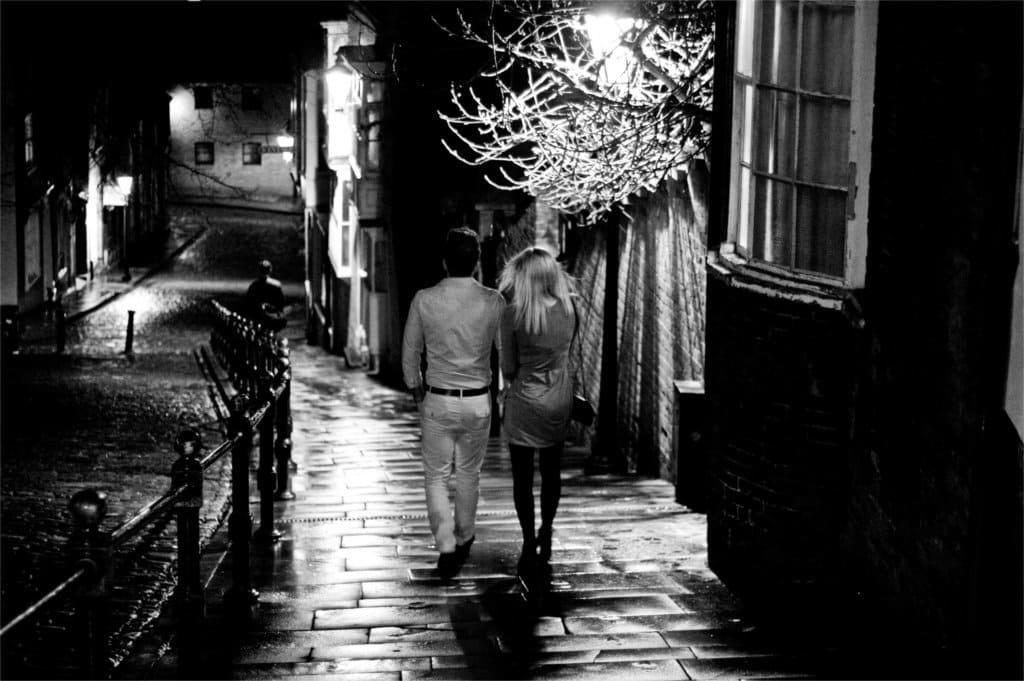 young couple on steep hill