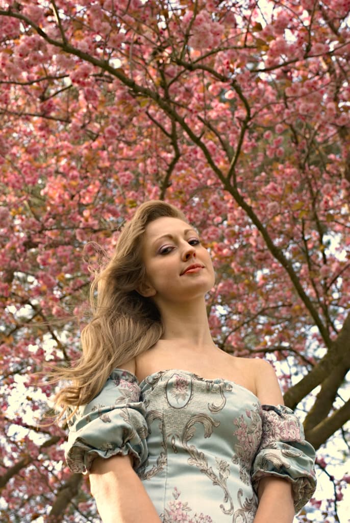 Returning to portraiture -kayleigh upwards shot with blossom tree
