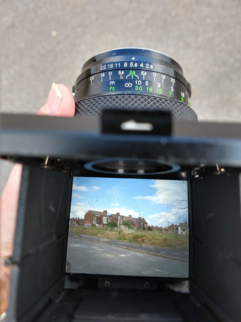 Looking through viewfinder of the Bronica (by Phlogger)