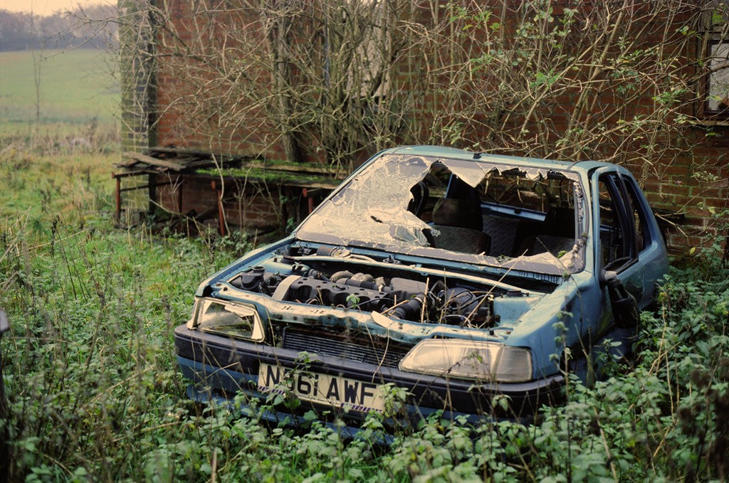 Shooting slide film - abandoned car in field